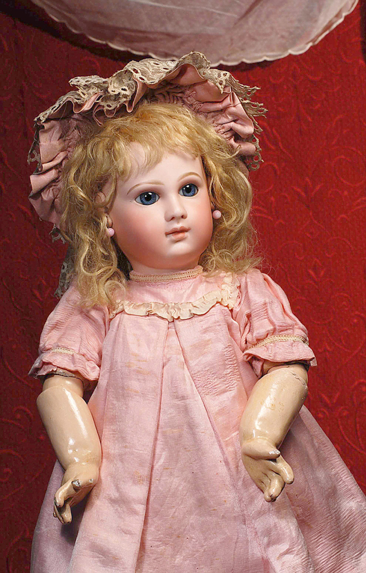 Alluring 20-inch Bru Jne Bebe with pale bisque and deep blue paperweight eyes. Image courtesy Frasher's Doll Auctions.